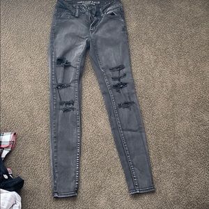 Black skinny jeggings with rips